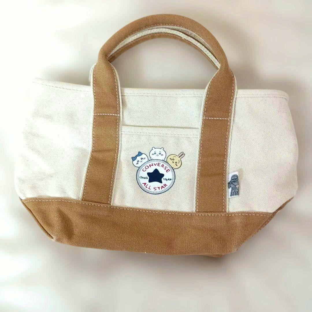 Canvas tote bag with brown handles and a ちいかわ Converse All Star patch on the front.