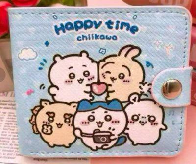 Folded polyester wallet with Chiikawa character illustration on a light blue background and a snap closure.