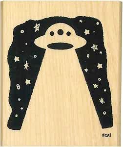 Wooden children's stamp face showing a black UFO design surrounded by stars.