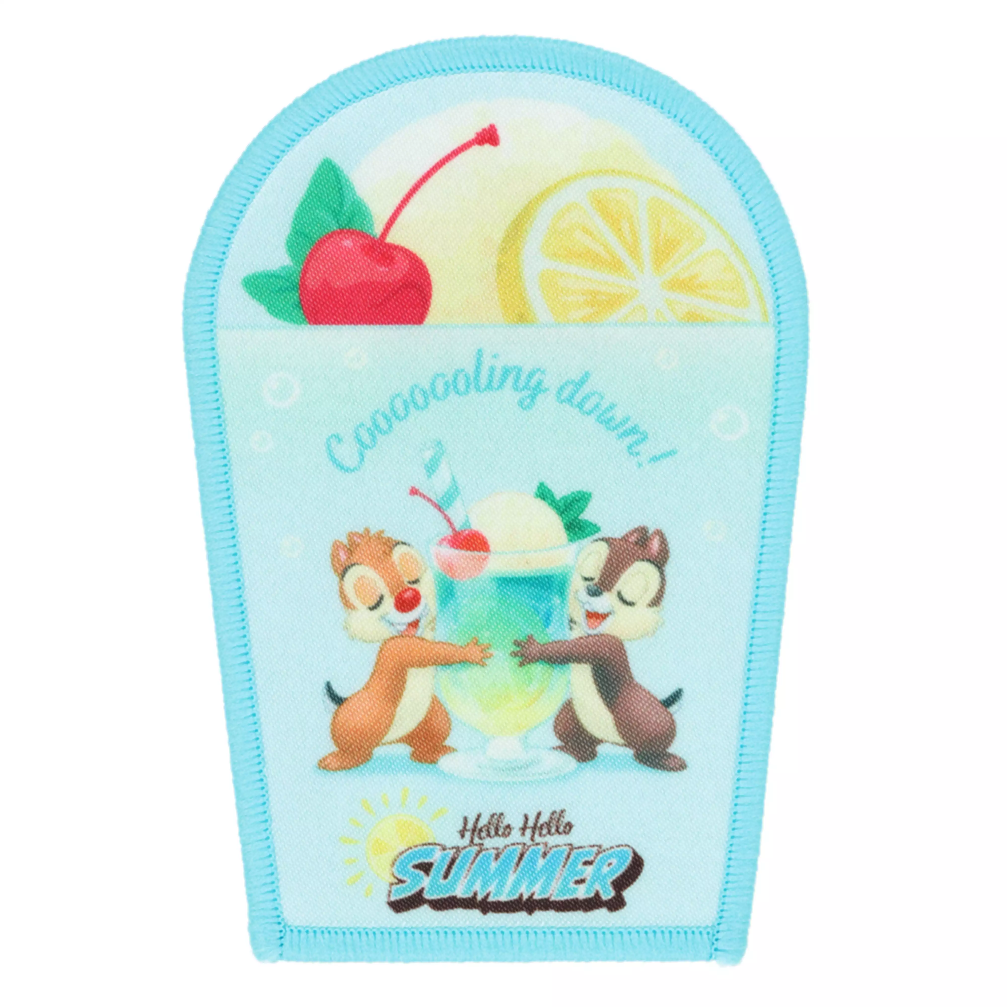 Fabric patch accessory depicting Chip and Dale sharing a summer drink with fruit accents and a light blue stitched border.