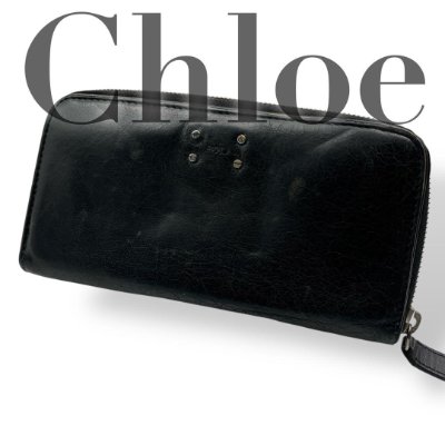 Black Chloe long leather zip-around wallet with an embossed logo visible on the front.