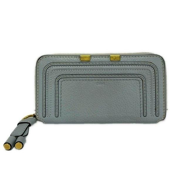 Light blue Chloe long zip leather wallet shown flat with round zipper and tassel visible.