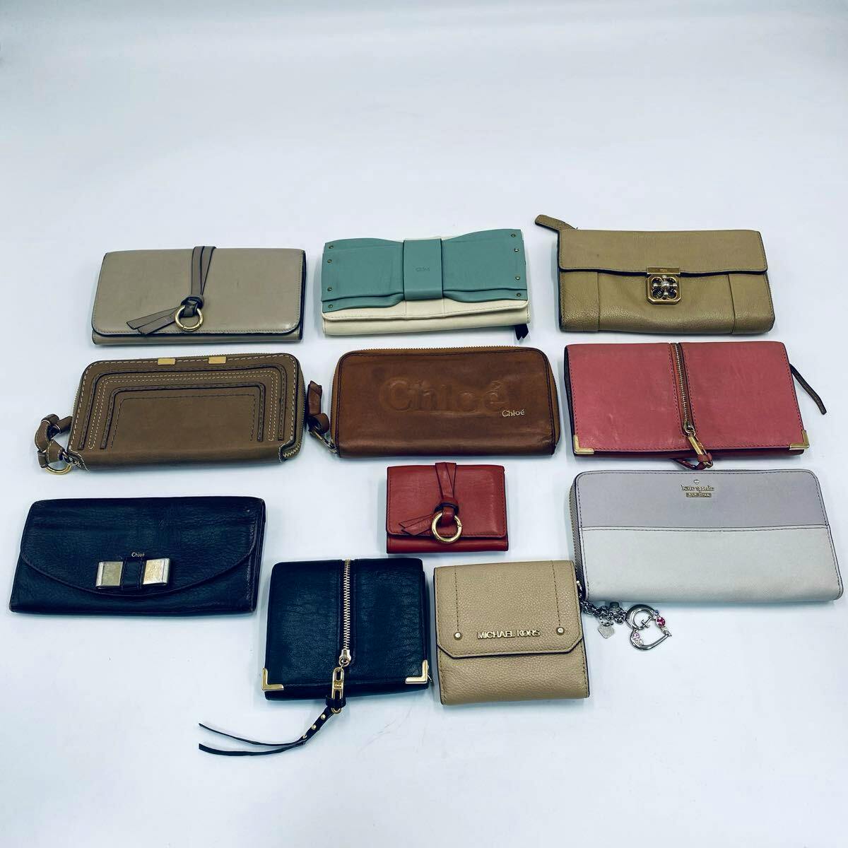 Eleven assorted wallets arranged on a white background, shown as a set.