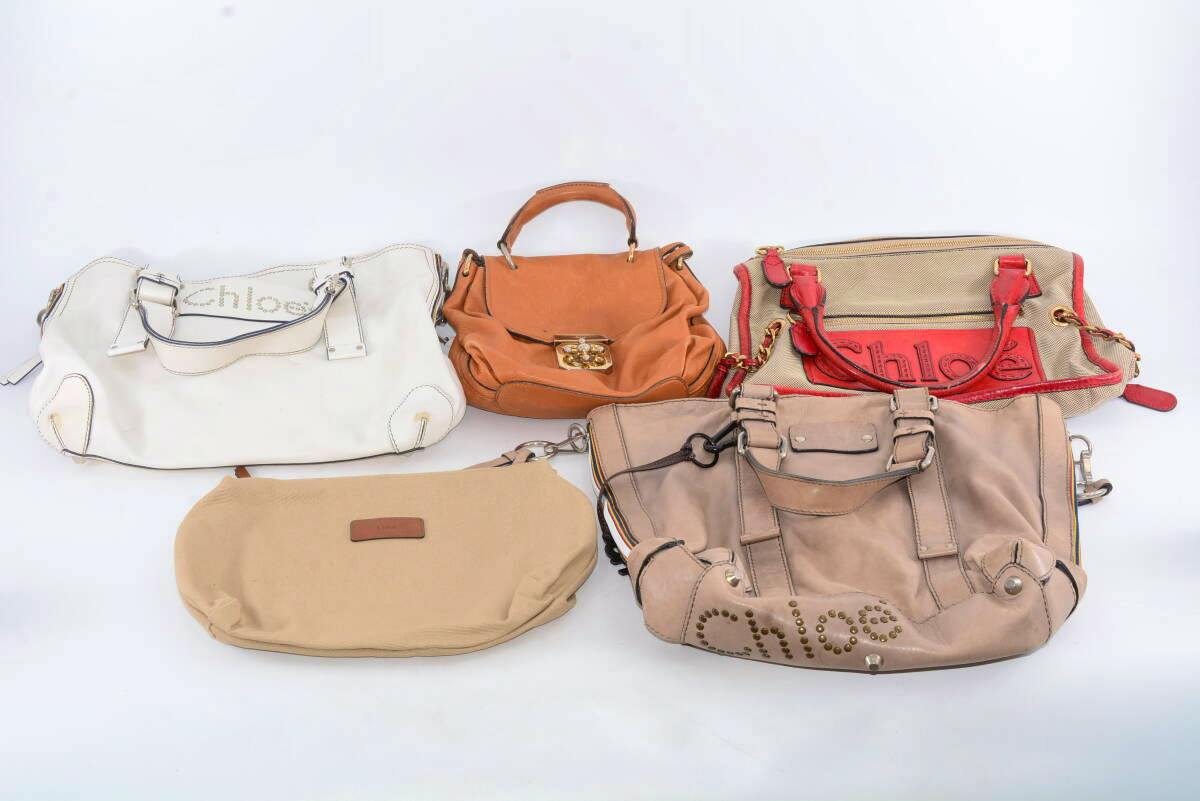 Five Chloe handbags in various leather and canvas materials arranged on a white background.