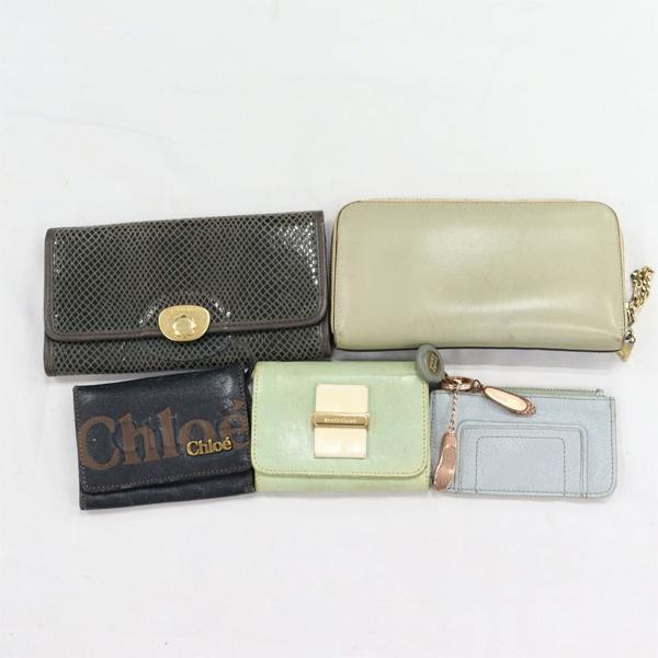 Five Chloe wallets and small leather accessories arranged on a white background.