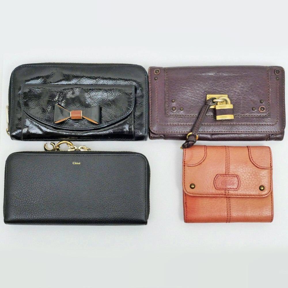 Four leather wallets, including a black Chloe zip-around long wallet and three smaller wallets, are arranged on a white background.