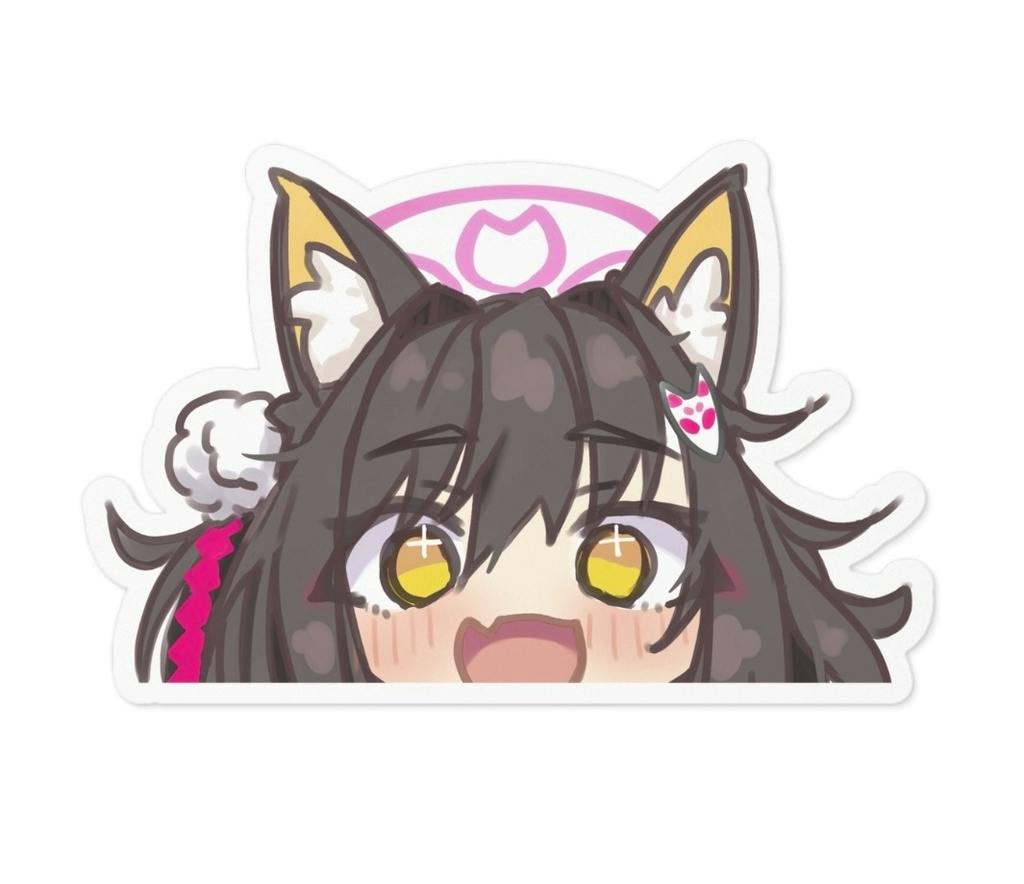 Paper sticker showing the top of an anime-style character's face with cat ears and yellow eyes.