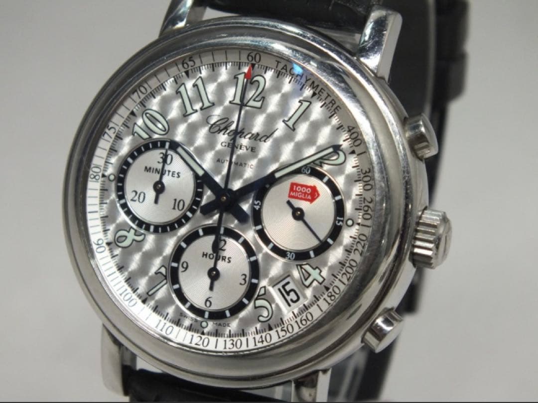 Three-quarter front view of the Chopard 8331 Mille Miglia automatic chronograph watch showing its patterned silver dial, subdials, crown, pushers, and leather strap.