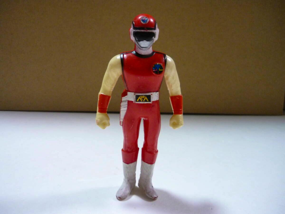 Front view of the Red Flash (Flashman) plastic figure (about 12cm) standing on a white surface.