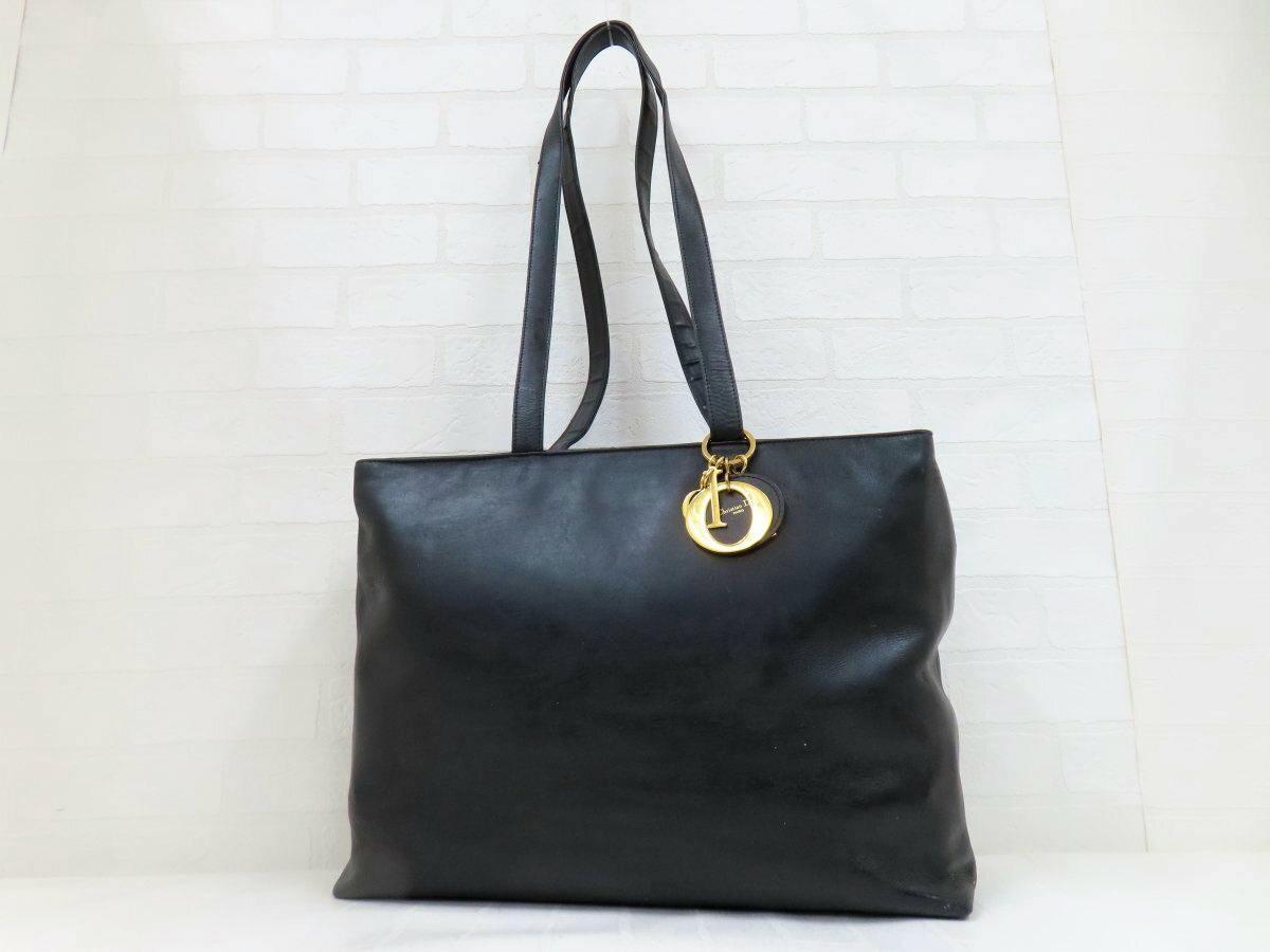 Black Christian Dior calf leather tote shoulder bag with gold hardware and double straps photographed against a white background.