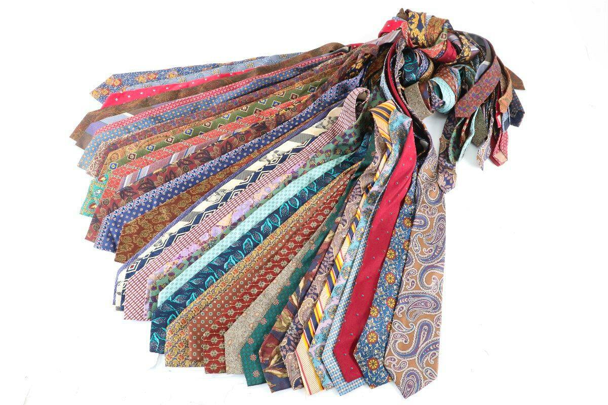 A fanned display of many men's silk neckties (Christian Dior) in various patterns and colors.