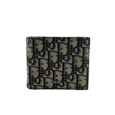 Navy Christian Dior Oblique canvas bi-fold wallet showing the front exterior with repeating Dior pattern and small DIOR logo.