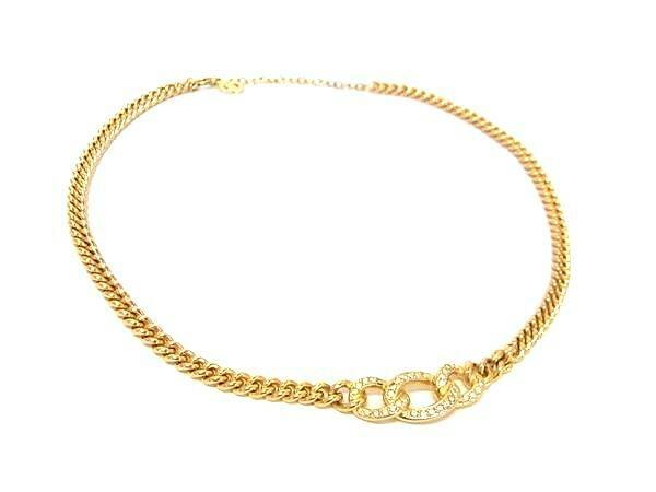 Gold-tone Christian Dior necklace with a linked rhinestone-encrusted pendant on a white background.