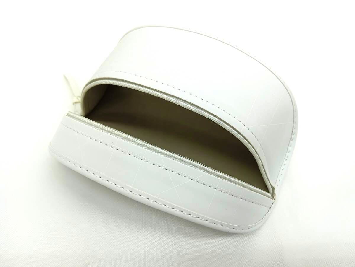 Open white Dior zippered sunglasses case showing the interior.