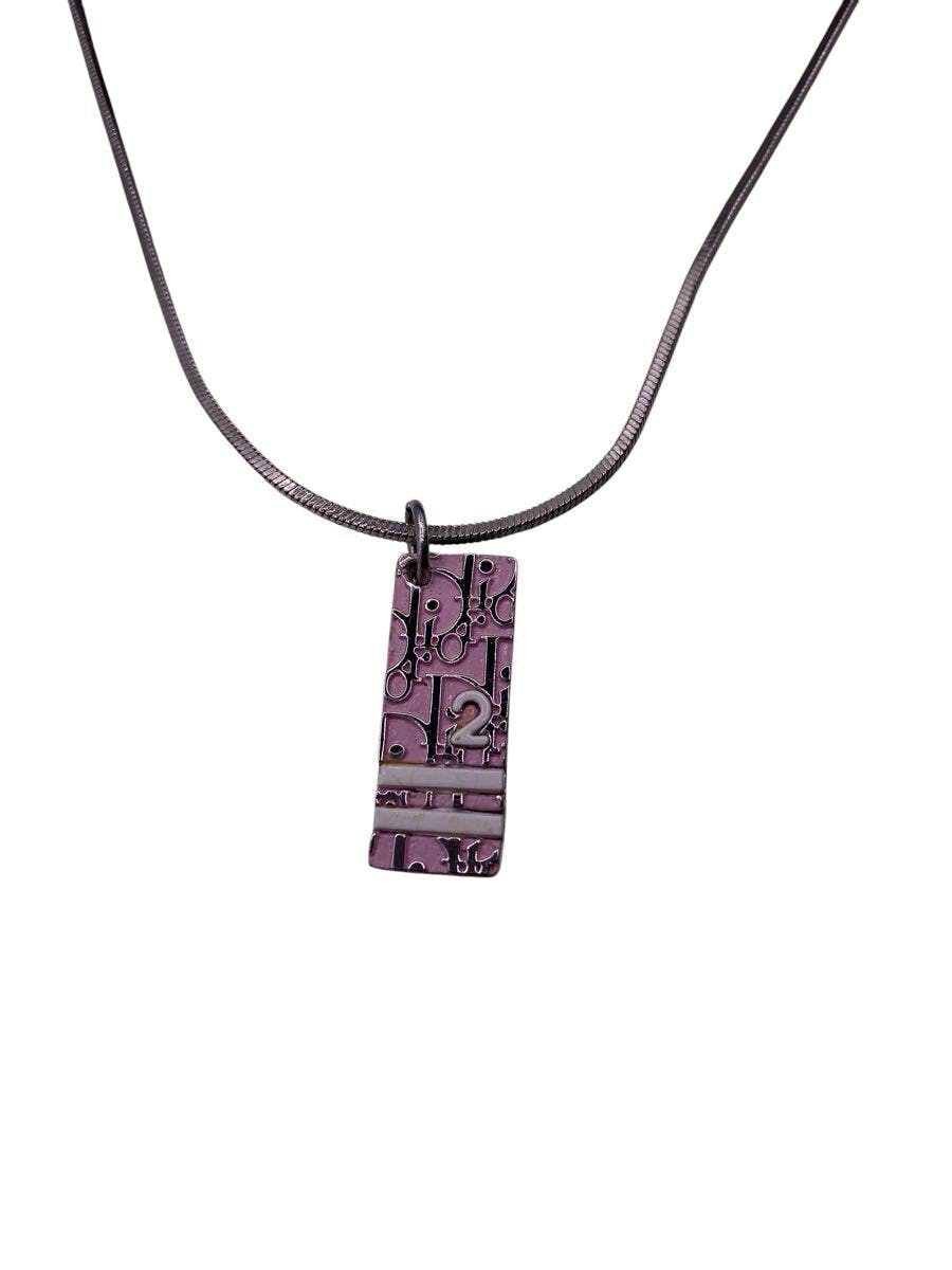 Pink Christian Dior rectangular pendant necklace with embossed pattern shown on a dark chain.