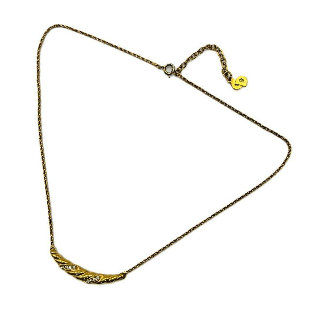 Gold-plated rope chain necklace with a curved pendant set with eight clear rhinestones, shown on a white background.
