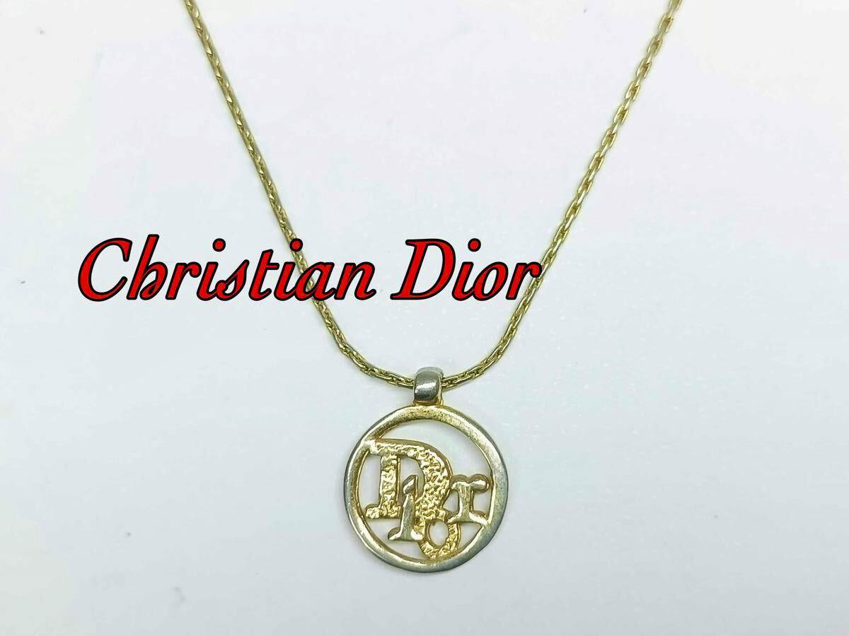 Gold-tone Christian Dior circle logo pendant necklace displayed on a white background.
