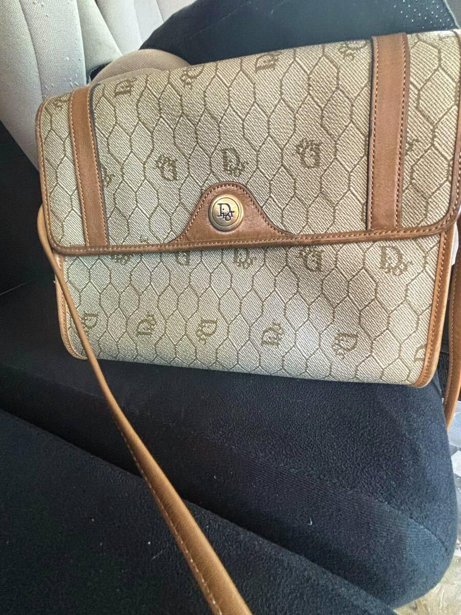 Front view of the Christian Dior nylon shoulder bag with honeycomb pattern, leather trim, and a round metal Dior clasp.