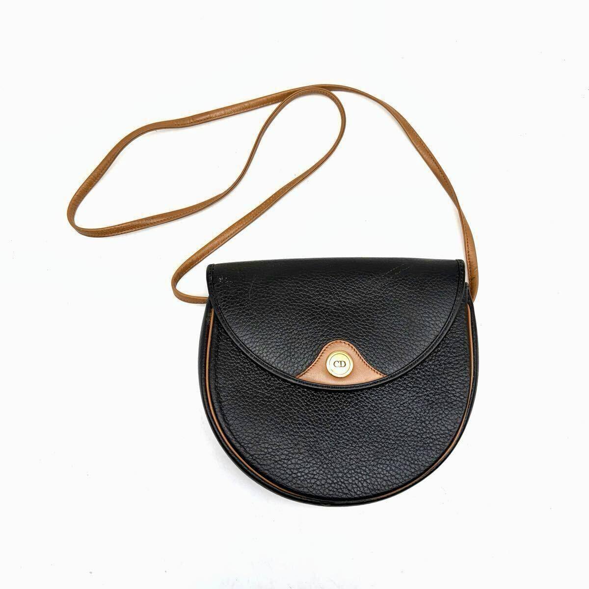 Front view of the Christian Dior vintage black leather shoulder bag with brown strap and CD logo clasp.