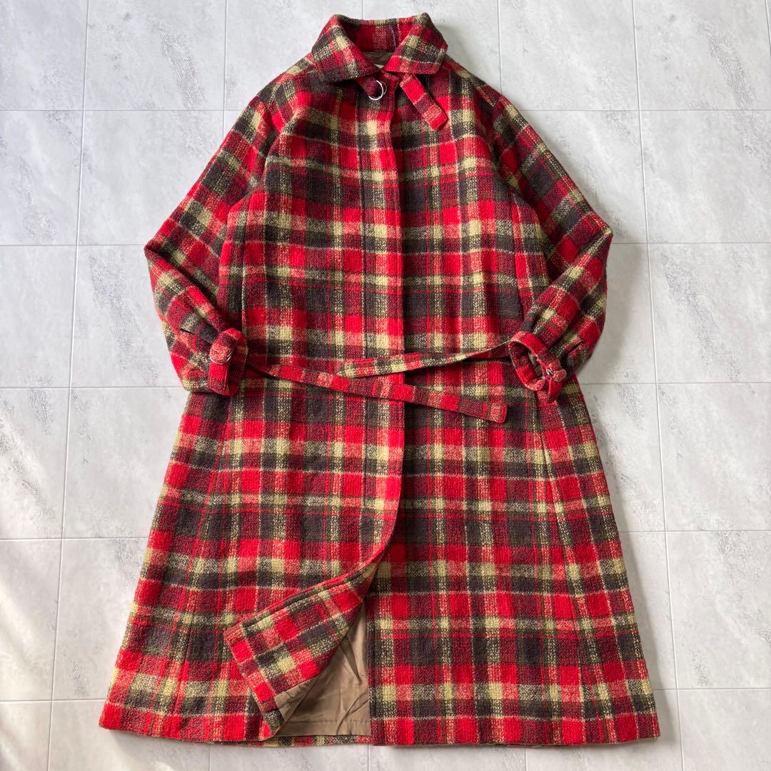 Red and green check wool belted long women's coat laid flat showing the full front and belt.