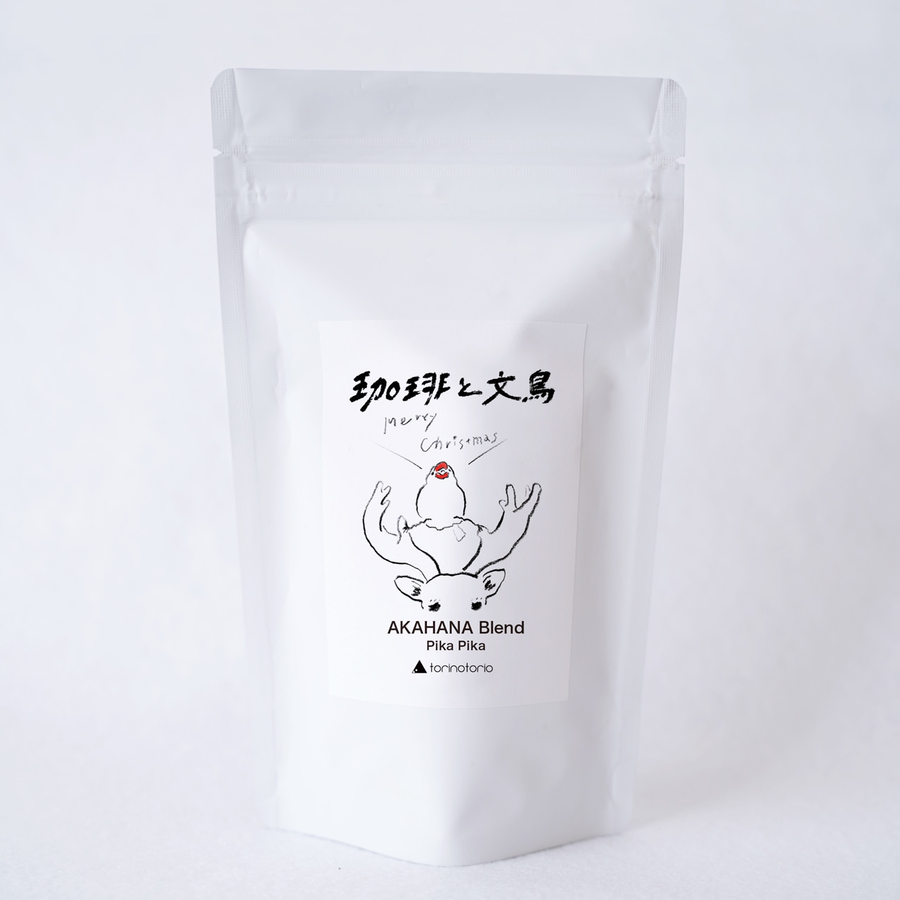 White resealable pouch of roasted coffee with a front label showing a stylized bird illustration and the product name.