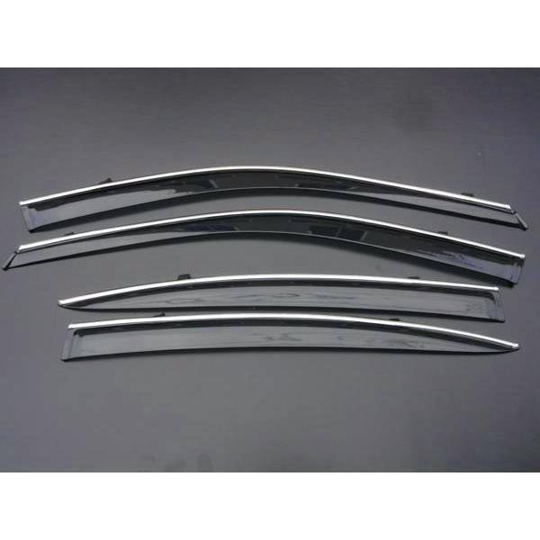 Four chrome-trimmed car window visors laid out on a dark surface.