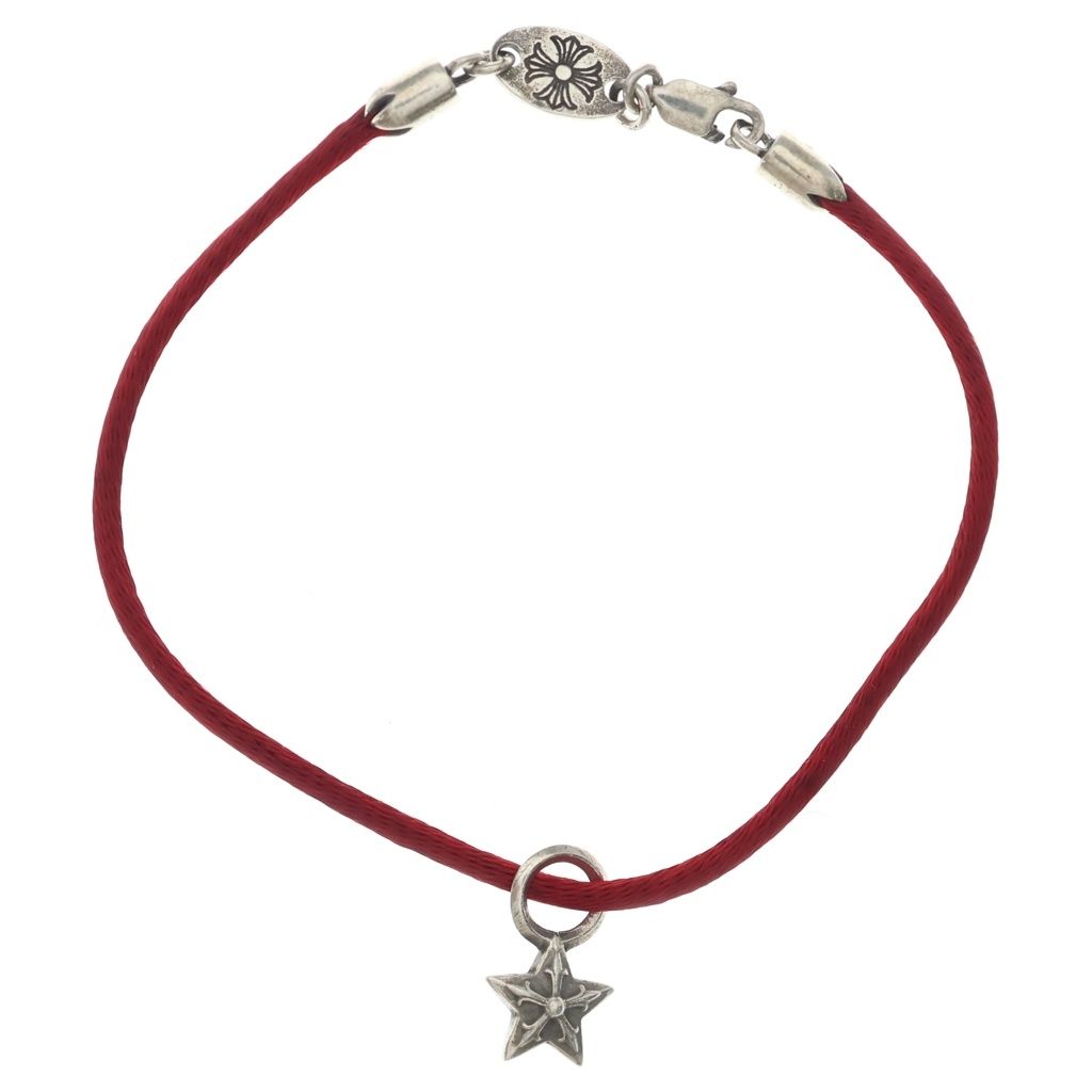 Red cord bracelet with a small silver star charm and a silver clasp.