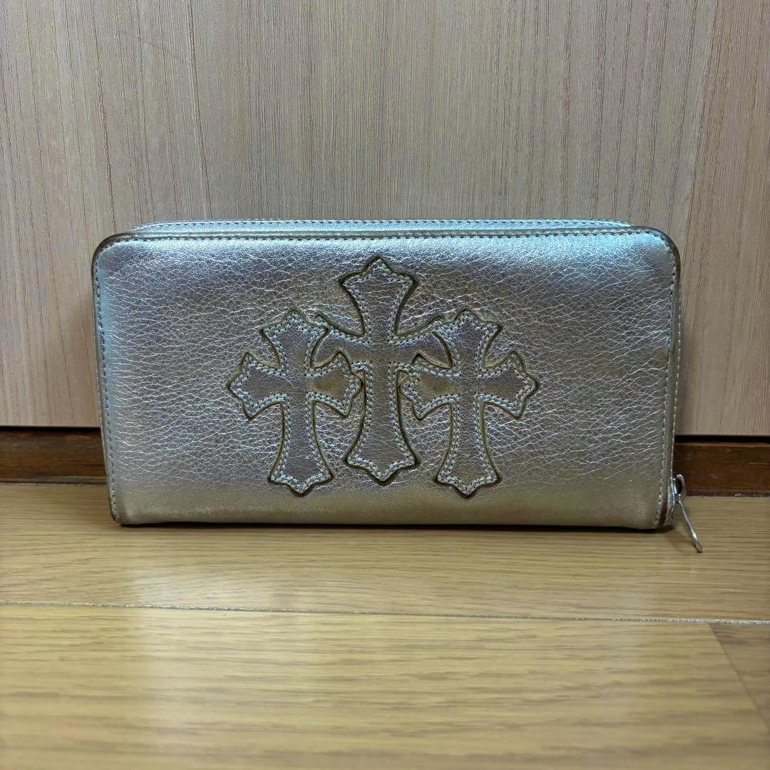 Front view of the long zip-around cow leather wallet showing three sewn cemetery-style cross patches.