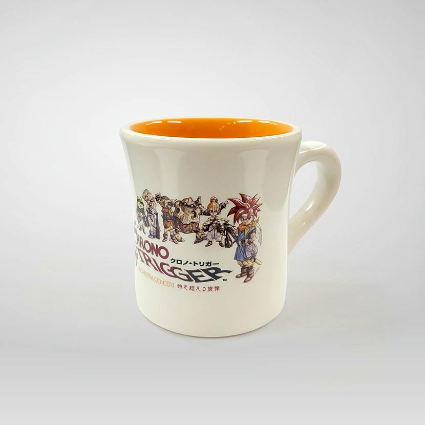 White ceramic mug with an orange interior showing Chrono Trigger character artwork and logo on the exterior.