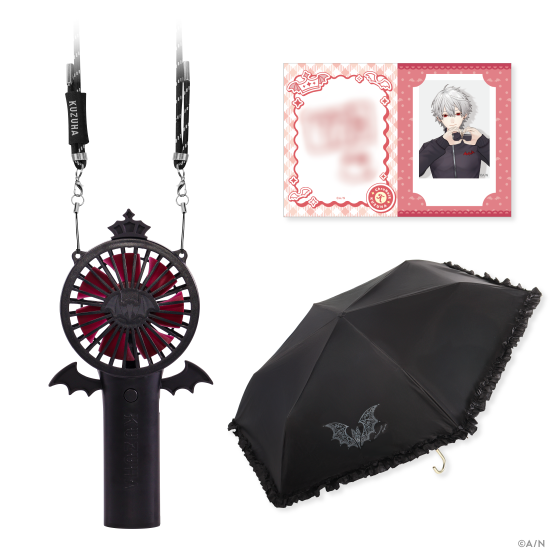 A black neck-strapped handy fan with bat-wing decoration and red blades, pictured with a black frilled umbrella and two character cards.