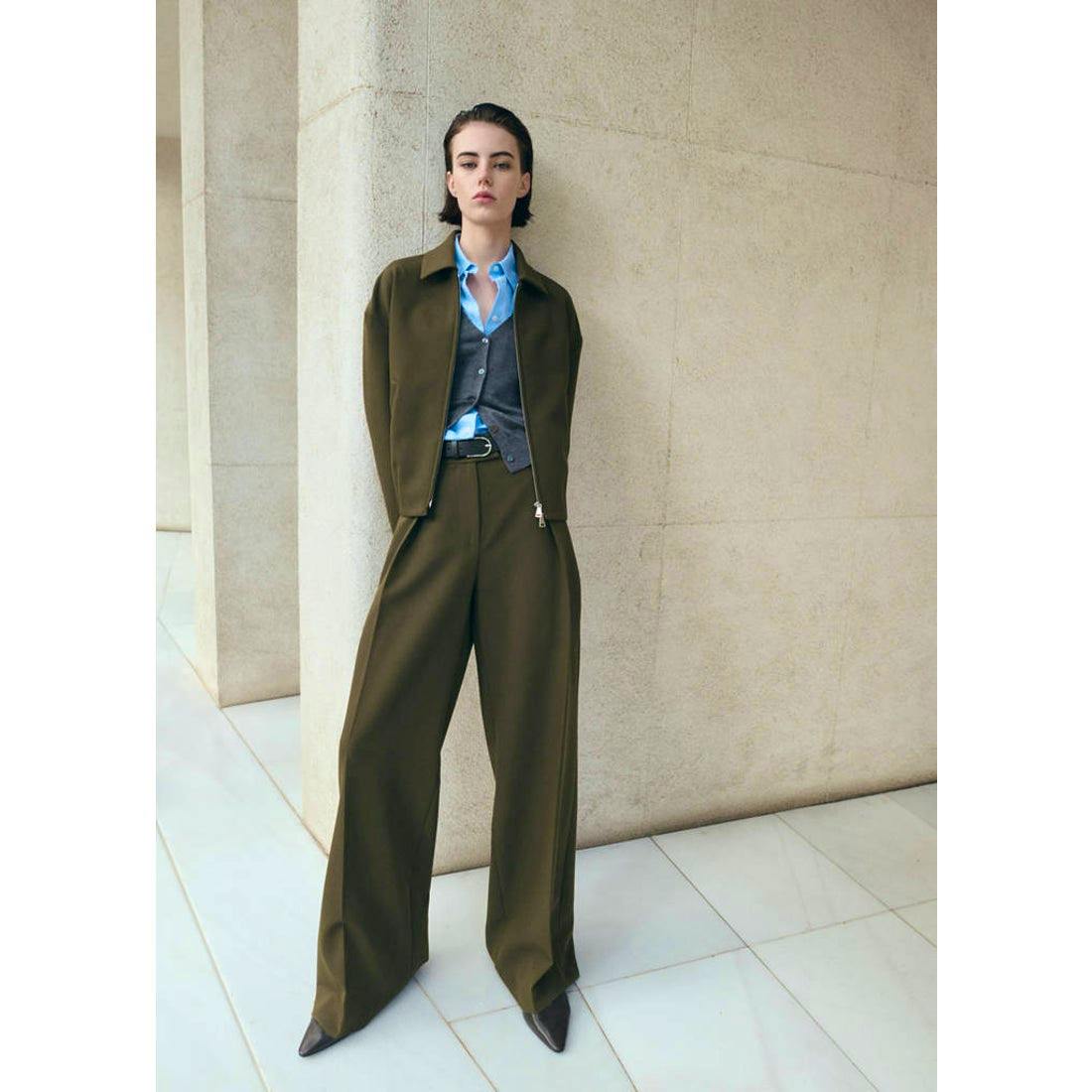 Front view of a model wearing khaki women's polyester wide-leg pants.