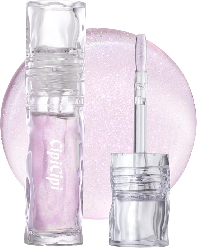 A clear lip gloss tube and applicator shown in front of a pink shimmery gloss swatch.