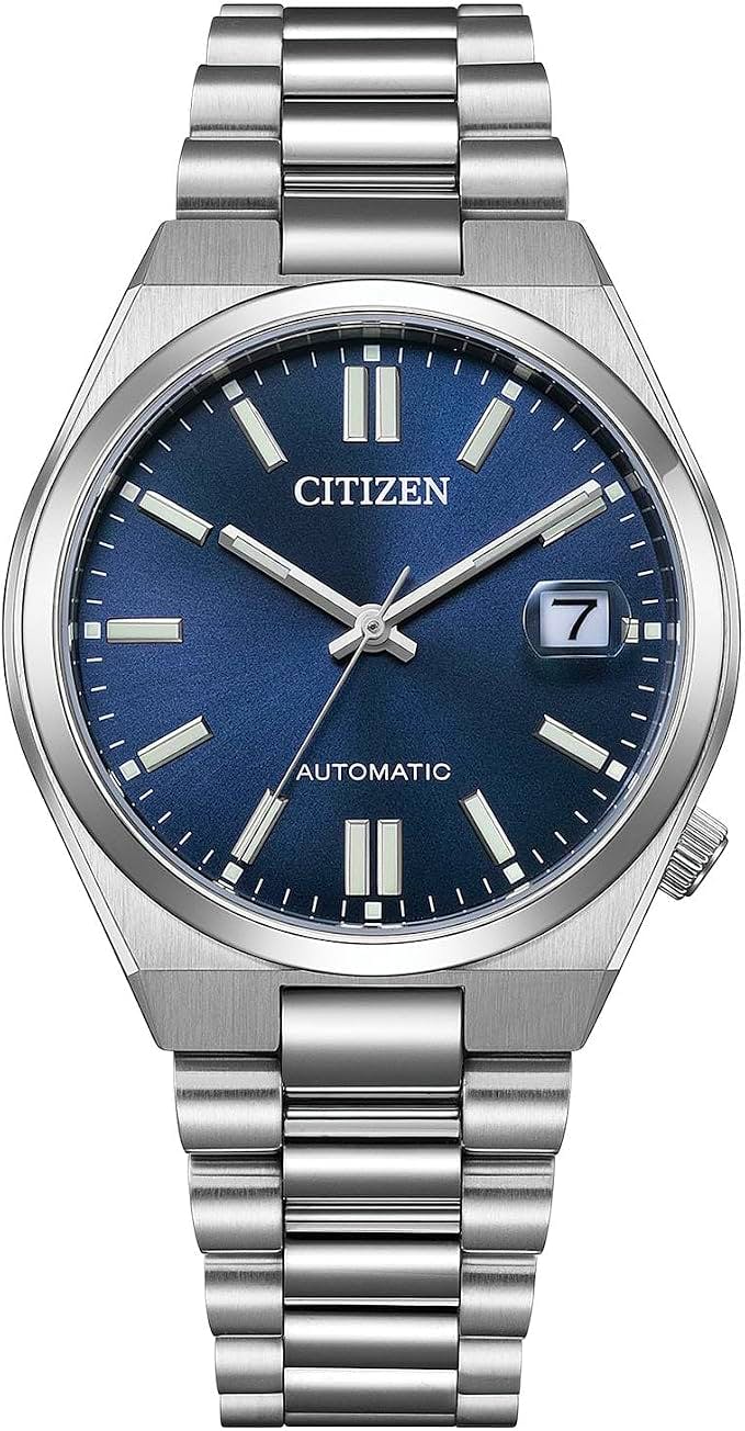Front view of a Citizen Tsuyosa Series automatic wristwatch with a gray metal case, blue dial, metal bracelet, and a date window at 3 o'clock.