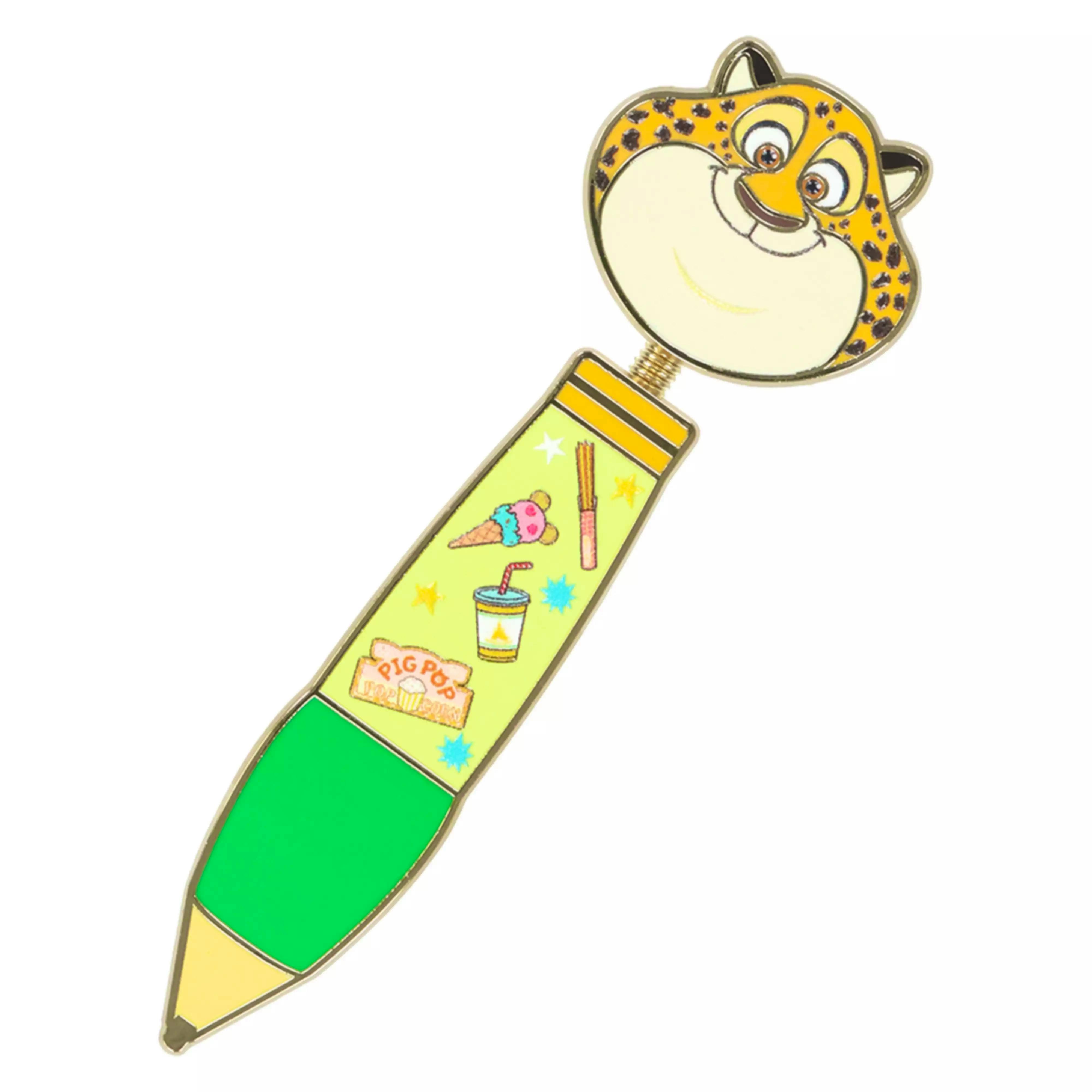 Close-up photo of the pin badge showing a spotted animal head attached to a pencil-shaped body on a white background.