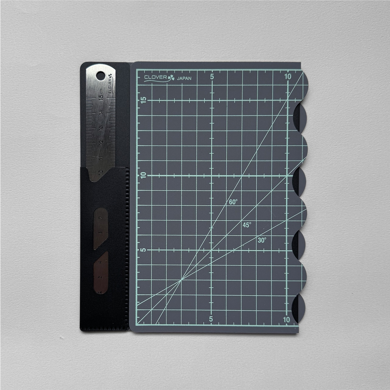 Photo of the B5 folding cutting mat with attached ruler, grid lines, and angle markings.