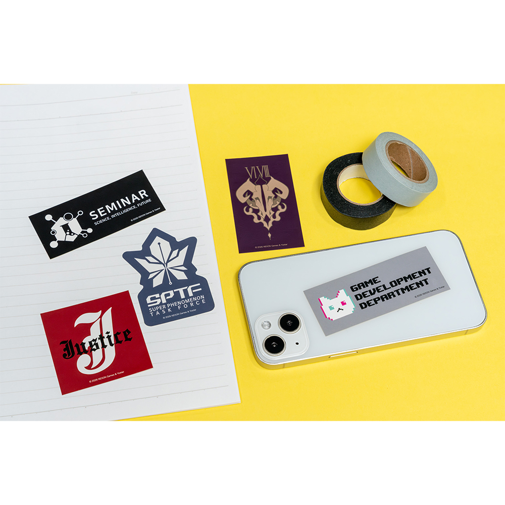 A set of club-logo stickers arranged on a notebook and a smartphone on a yellow background.