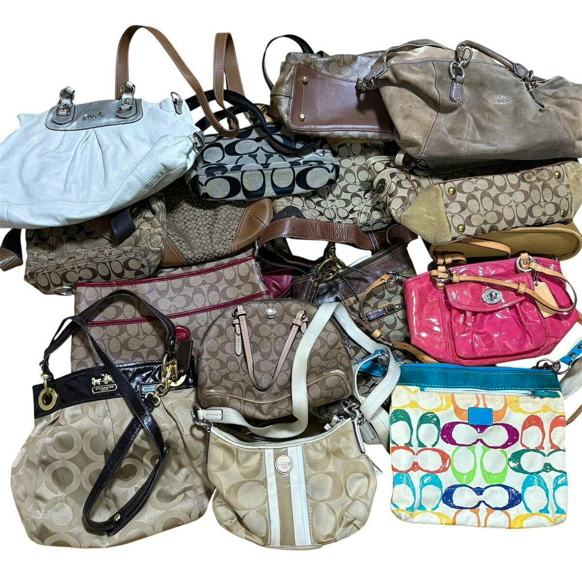 Seventeen COACH canvas and leather handbags and shoulder bags grouped together, shown from above on a white background.