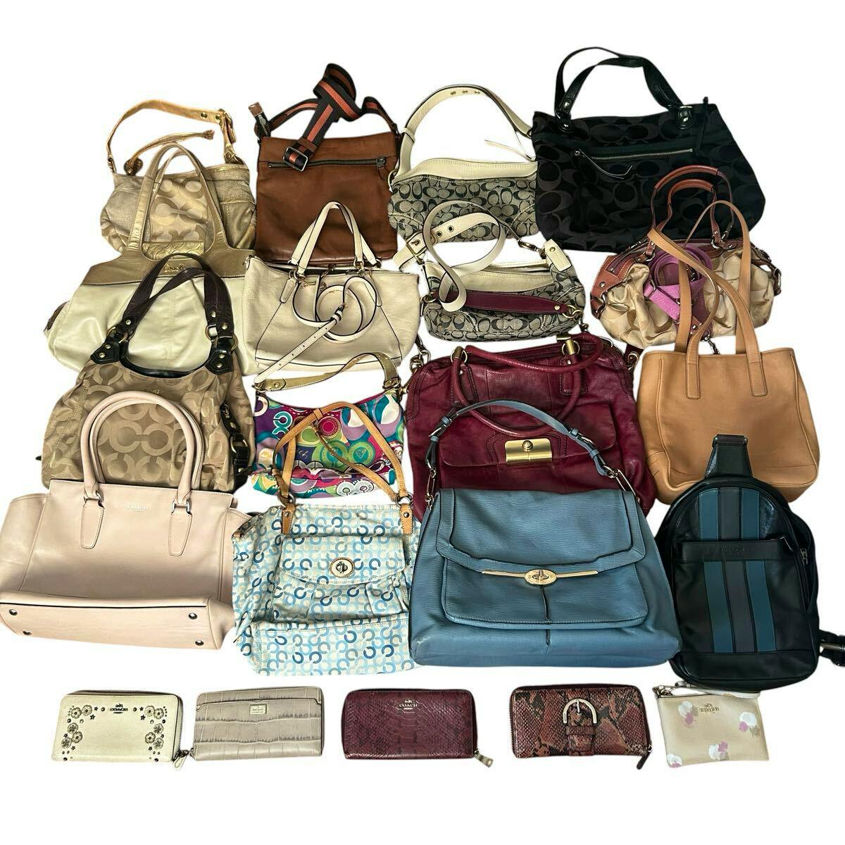 Several COACH handbags and wallets arranged in a flat lay on a white background, showing a variety of colors and styles.