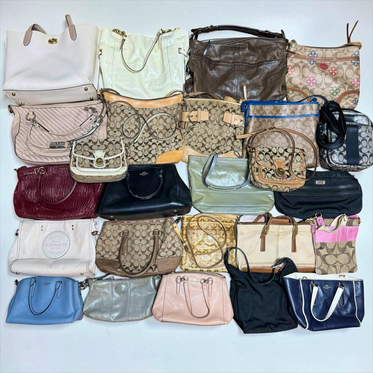 Multiple Coach handbags and small bags arranged in rows on a white background, showing various styles, colors, and signature Coach 'C' patterns.