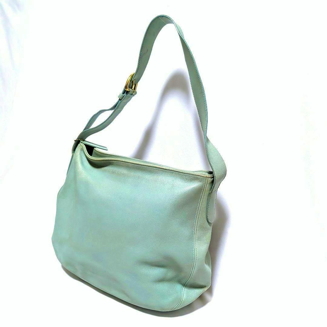 A light green Coach 4161 Soho Zip Hobo leather shoulder bag shown at a three-quarter angle against a white background.