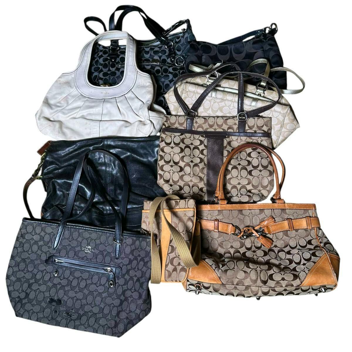 Nine Coach signature canvas and leather bags arranged together on a white background.