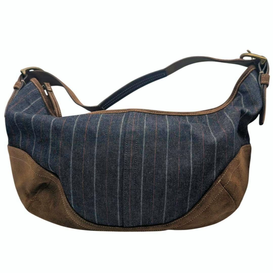 Coach striped denim and brown suede hobo one-shoulder bag shown on a white background.