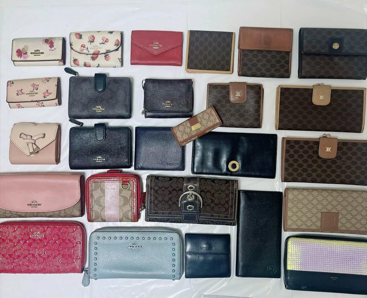 Multiple Coach and Celine wallets and small purses arranged flat on a white surface, shown as a grouped set.