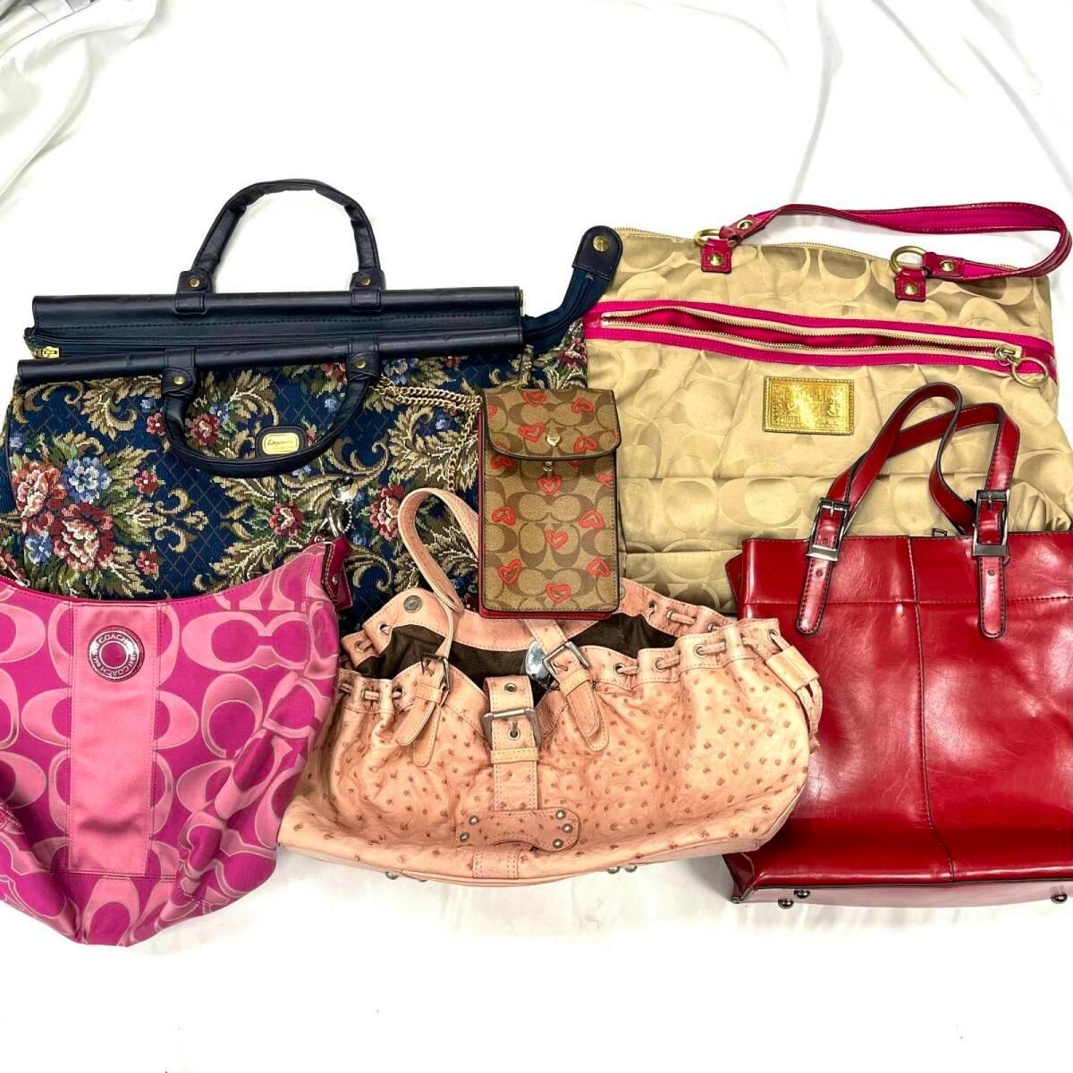 Six assorted handbags (COACH and other brands) arranged on a white background as a bulk set.