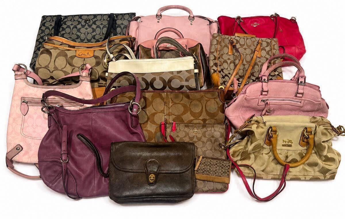 Multiple COACH bags and purses of various colors and prints arranged on a white background.