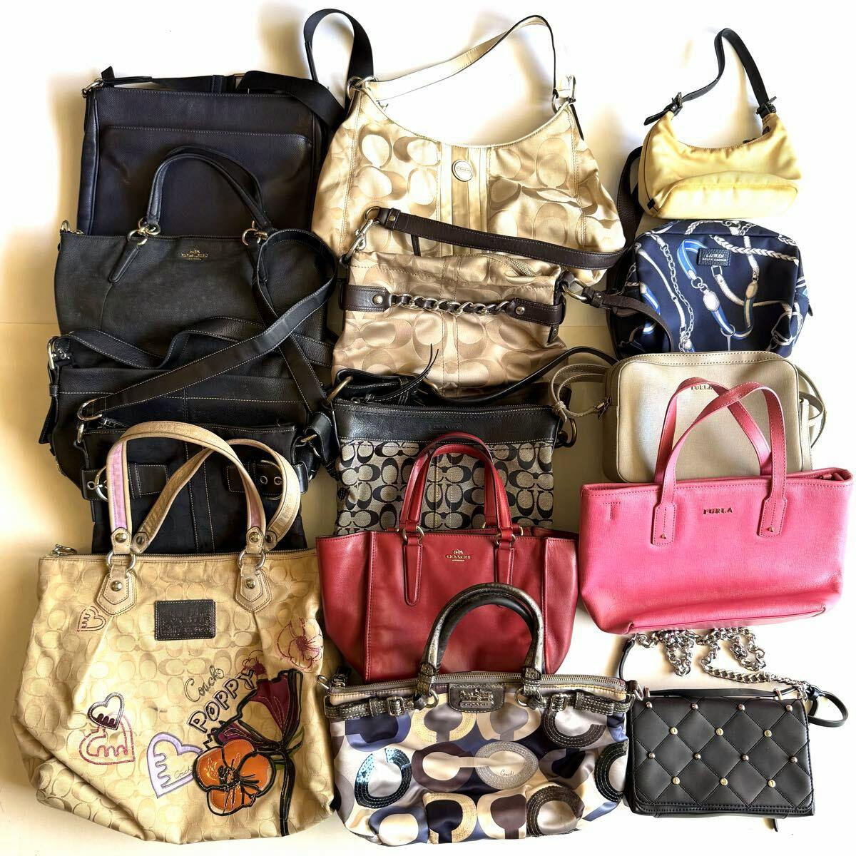 Flat lay of many COACH handbags and small bags arranged together on a white background.