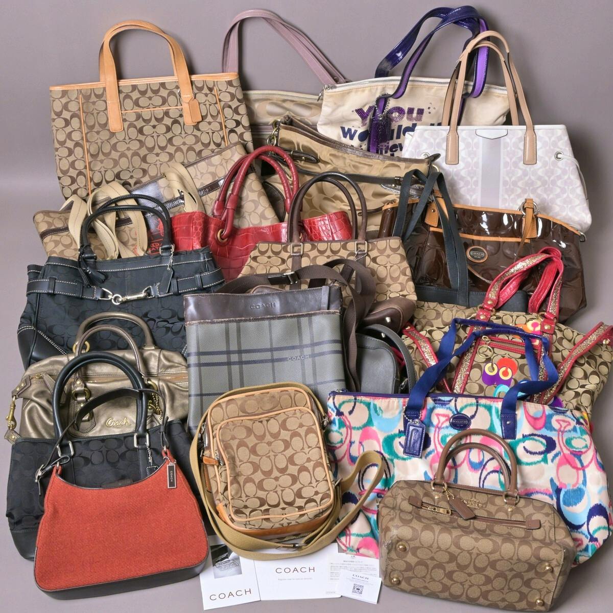 Photo of many Coach bags arranged together showing different styles and colors.
