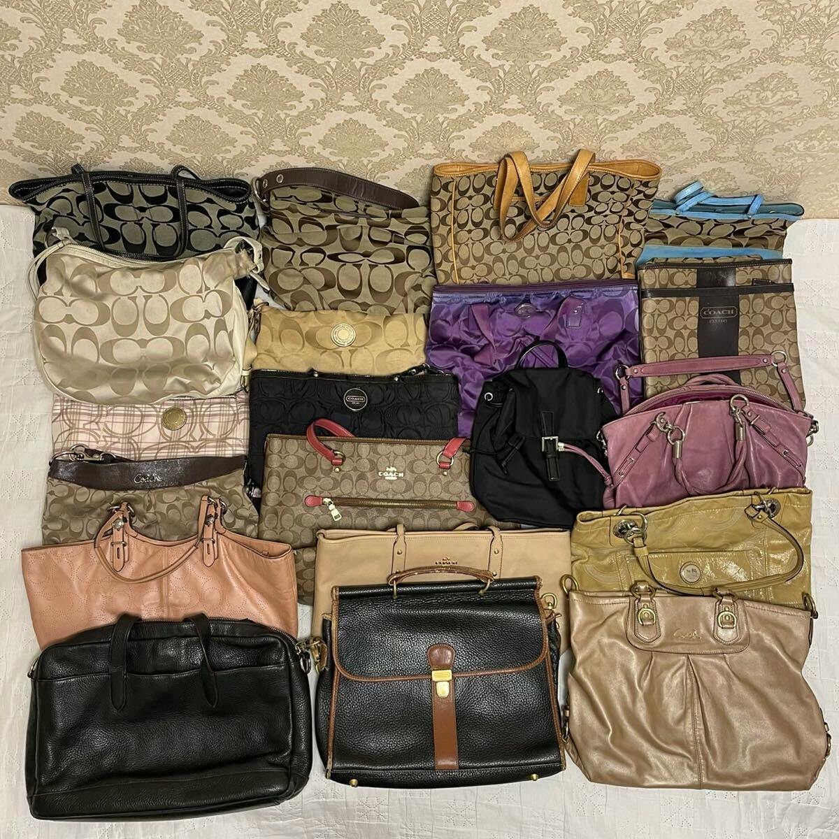 Top-down photo of a large assortment of COACH bags and totes arranged together, showing signature C patterns and various colors.