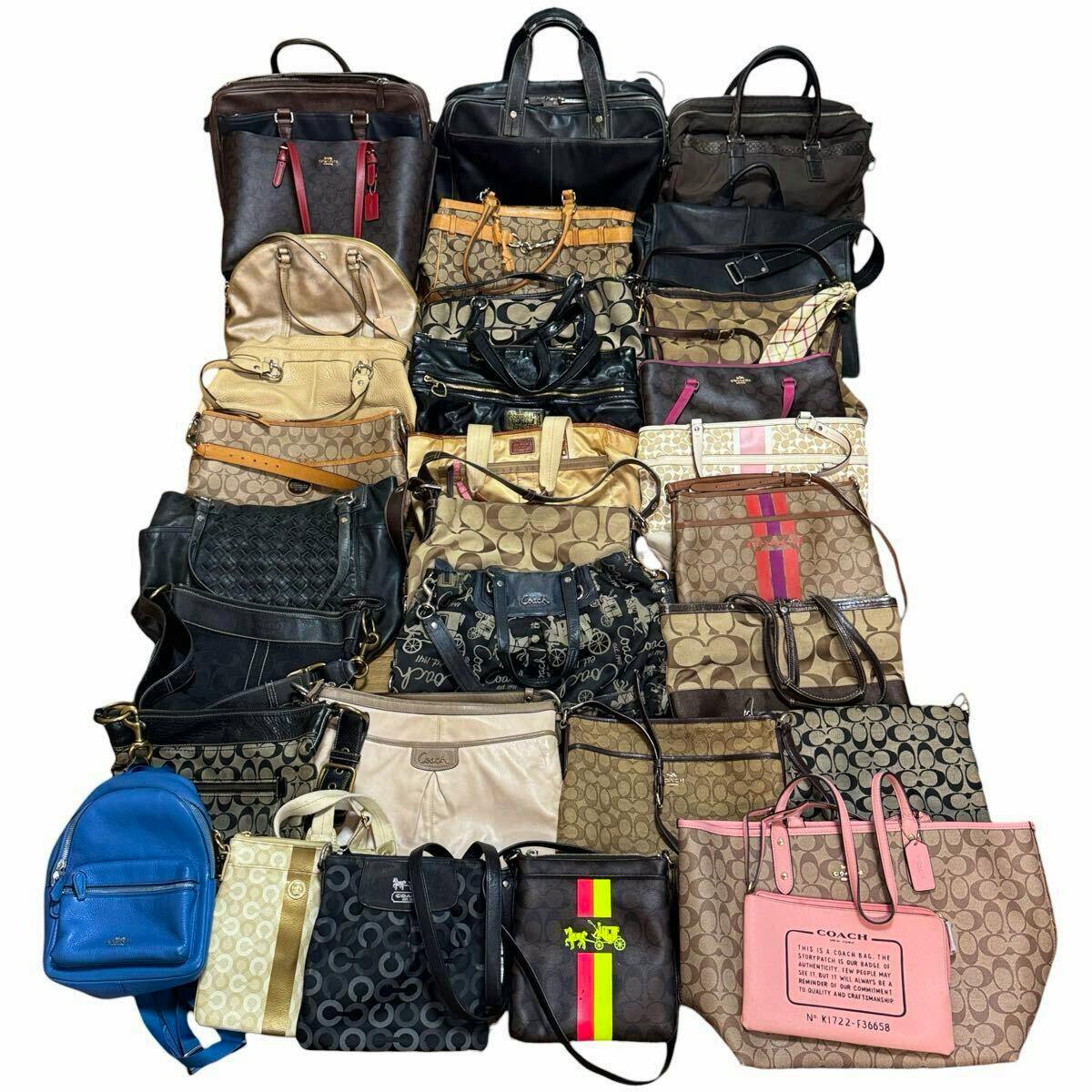 Top-down photo of a bulk set of Coach bags and purses arranged in rows, showing assorted signature canvas and leather styles.