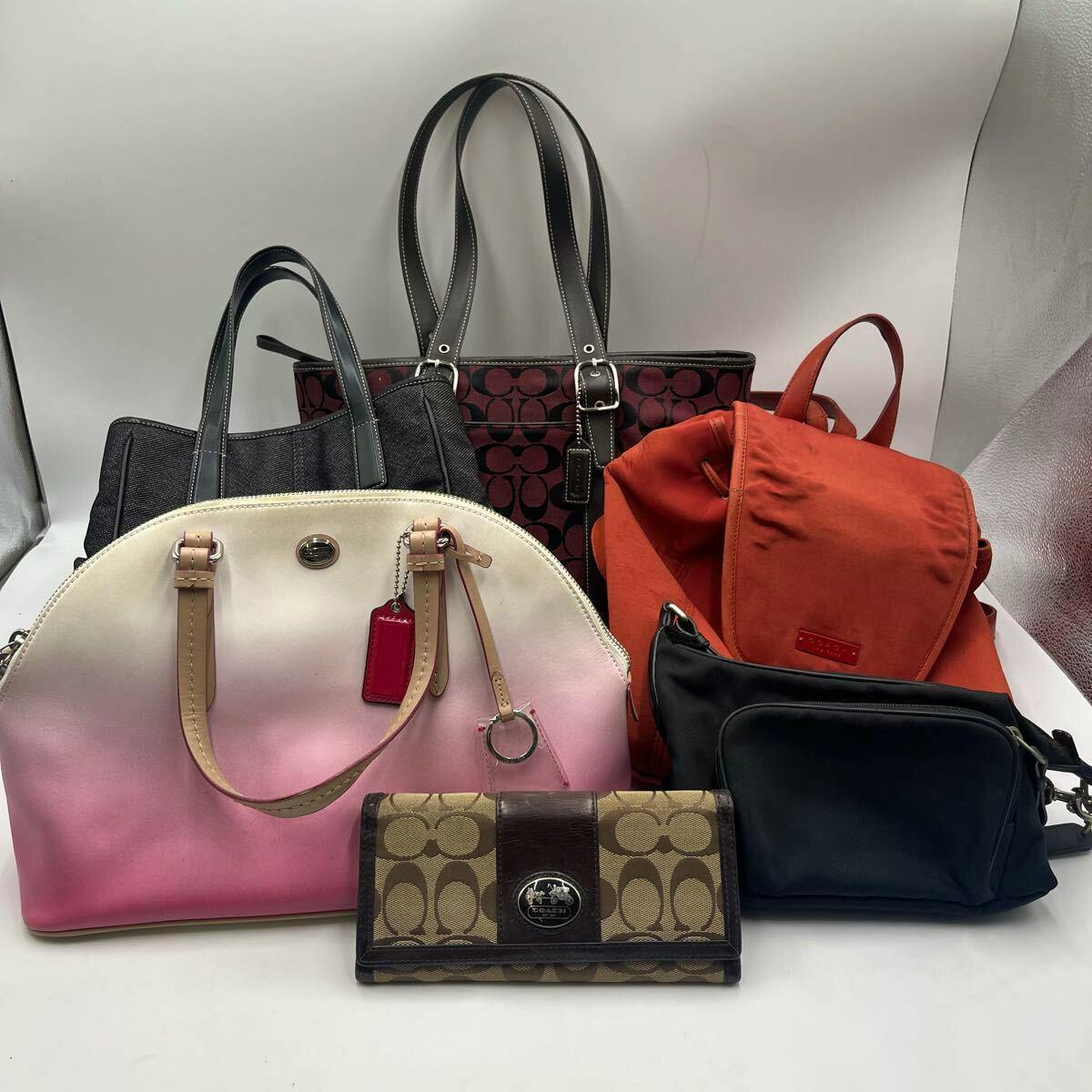 Group photo of six Coach items on a white background, including multiple handbags, a red backpack, and a Coach wallet in front.